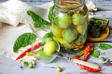 Pickled green tomatoes for winter in jars