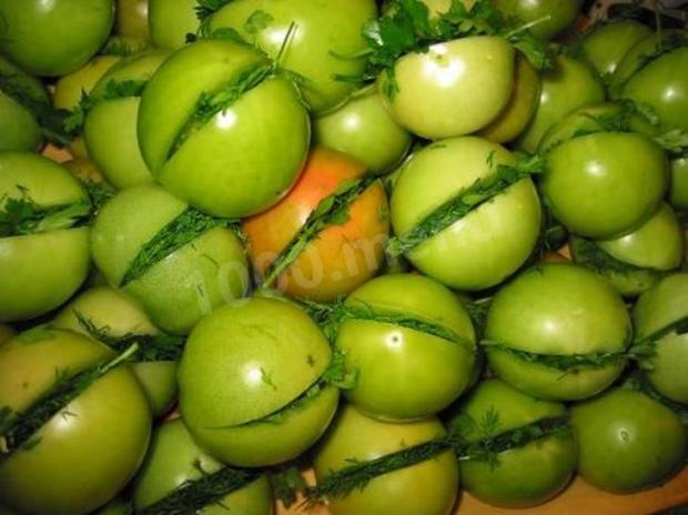 Pickled green tomatoes with garlic on winter