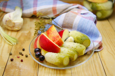 Cucumbers with apples pickled for winter