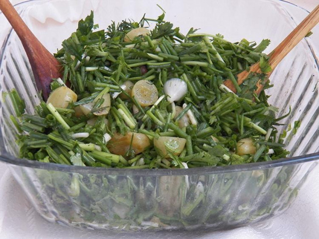 An unusual salad with pickled grapes and green onions