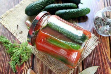 Cucumbers in tomato filling with garlic for winter
