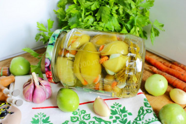 Pickled green tomatoes stuffed with garlic for winter