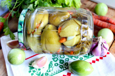 Pickled green tomatoes stuffed with garlic for winter