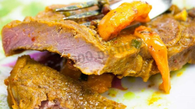 Beef steak with apricot slices