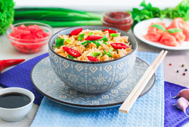 Rice with soy sauce in a frying pan