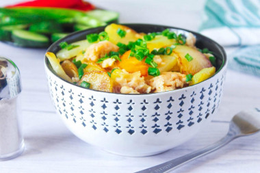 Fried potatoes with minced meat in a frying pan