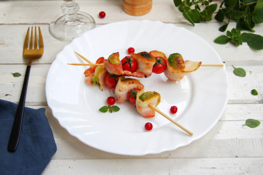 Skewers of Brussels sprouts with bacon in a frying pan