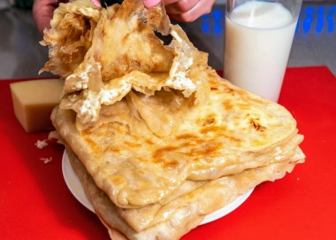 Tortillas stuffed with hard cheese in a frying pan