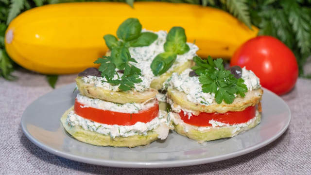 Appetizer of zucchini with tomatoes and cottage cheese dressing