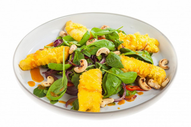 Spinach salad with fish and sea buckthorn sauce