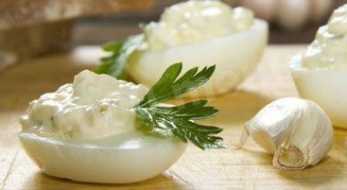 Eggs stuffed with pickles, with mayonnaise and garlic