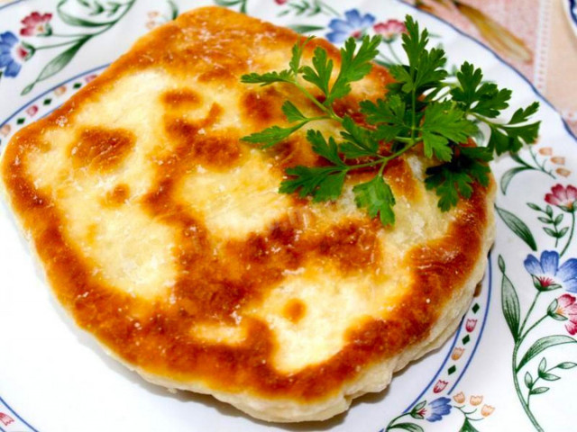 Tortillas with cheese and herbs in a pan