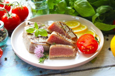 Tuna steak fried in a frying pan