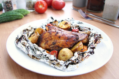 Chicken on coals in foil