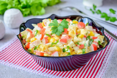 Salad with orange and crab sticks