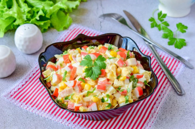 Salad with orange and crab sticks