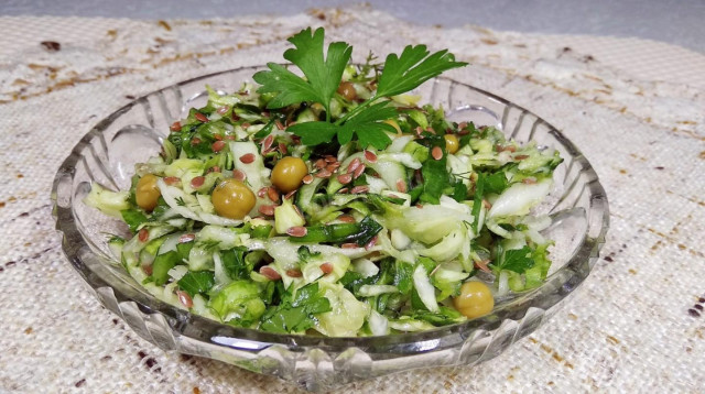 Salad of young cabbage with cucumbers, spinach and herbs