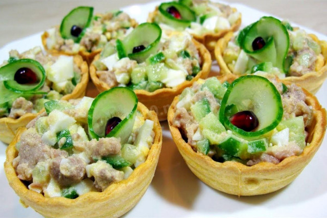 Tartlets with cod liver and cucumber