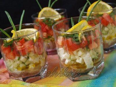 Portioned tomato salad with tuna