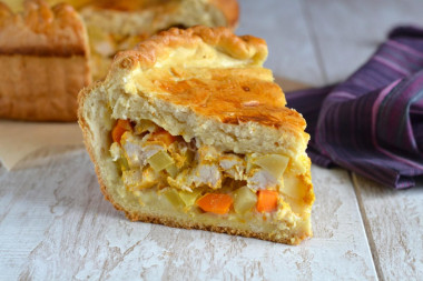 Pie with chicken and potatoes from yeast dough