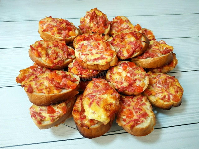 Incomparable mini pizzas on a loaf in the oven