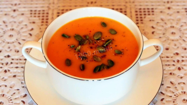 Pumpkin cream soup with potatoes and basil