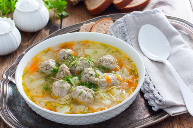 Soup with meatballs in a slow cooker