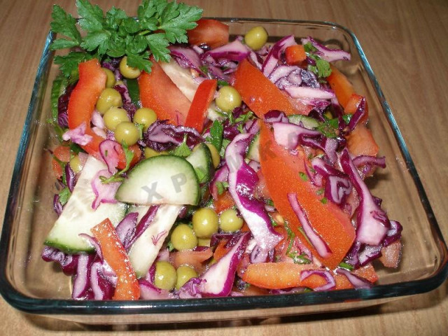 Red cabbage salad with vegetables and green peas