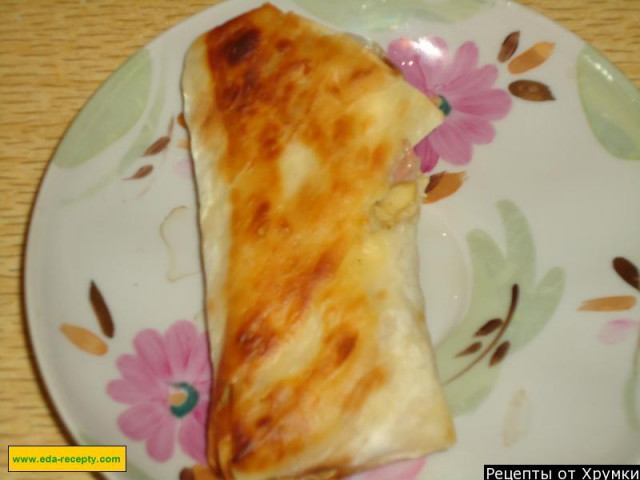 Appetizer in lavash with cheese and ham
