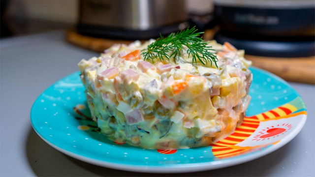 Olivier salad with ham and cucumbers