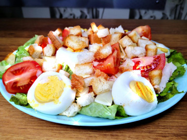 Caesar salad with chicken and sauce