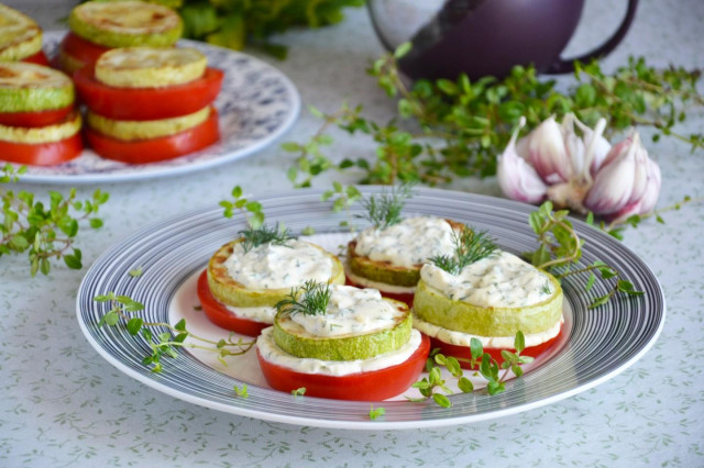 Fried zucchini with tomatoes and mayonnaise