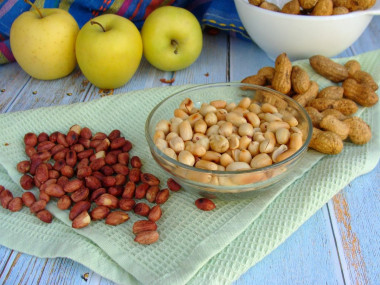 Fried peanuts in a frying pan in the husk