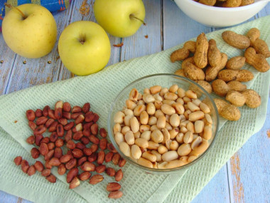 Fried peanuts in a frying pan in the husk