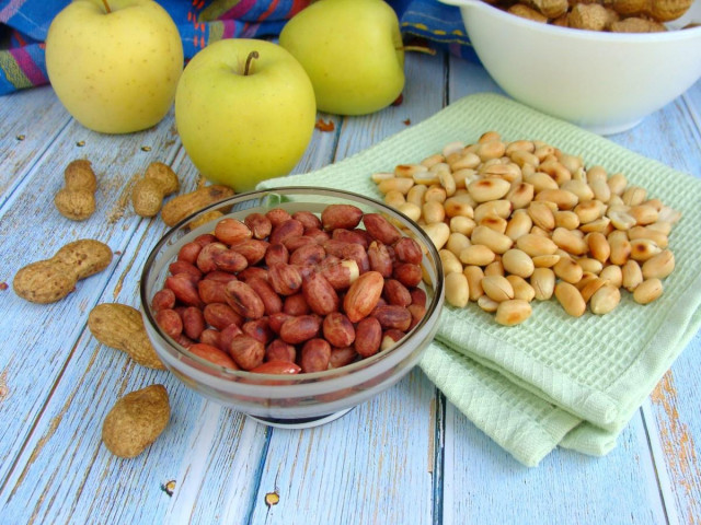 Fried peanuts in a frying pan in the husk