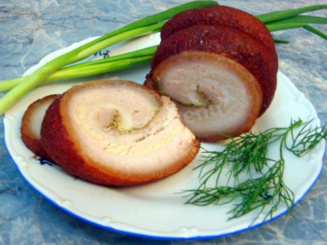 Roll of bacon boiled in onion husks with garlic