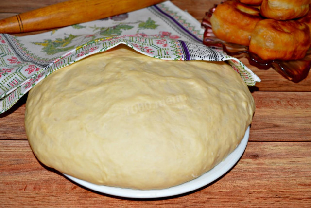 Dough for pies in a frying pan on water