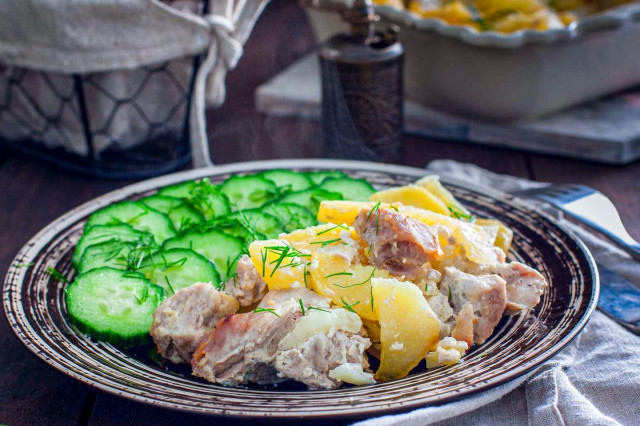 Pork in mayonnaise, baked with potatoes and onions