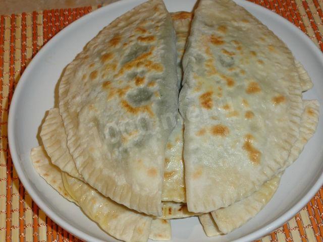 Unleavened dough with cheese, herbs and dry spices