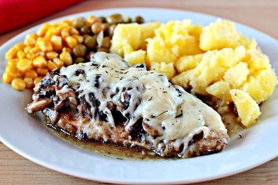 Chicken breast with mushrooms and cheese with herbs
