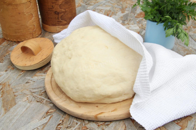 Dough for fried pies in a frying pan