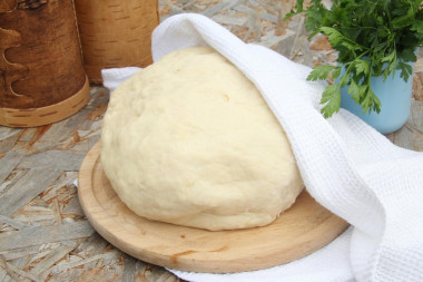 Dough for fried pies in a frying pan