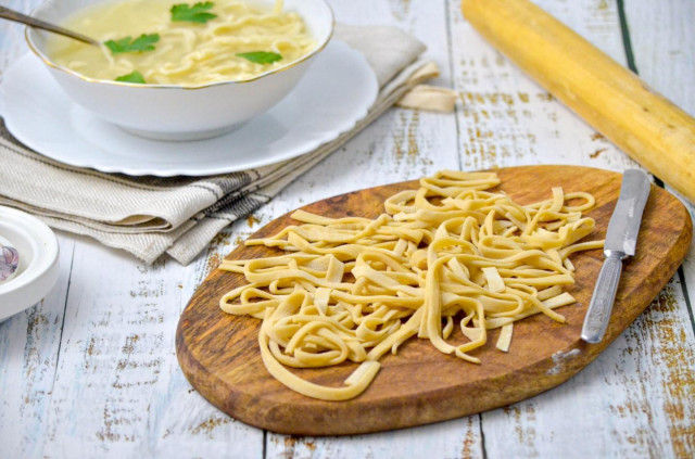 Homemade noodles for soup on eggs