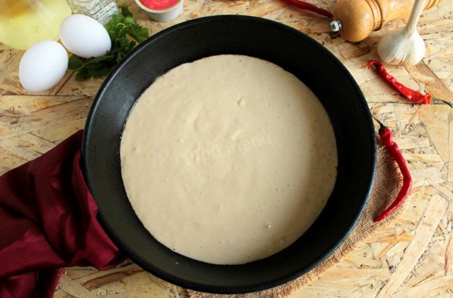 Pizza dough in a frying pan