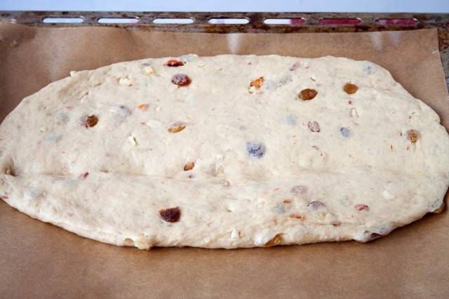 Yeast dough with nuts and candied fruits for roll
