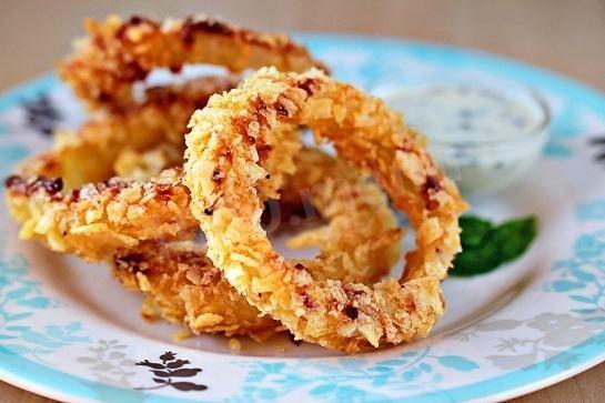 Onion rings in chips appetizer for beer and white wine