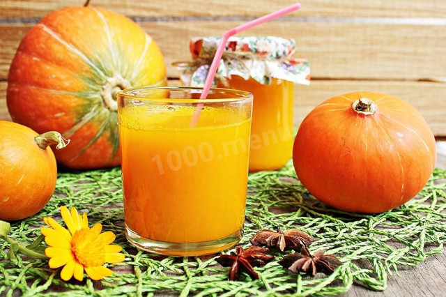 Pumpkin juice on a juicer for winter