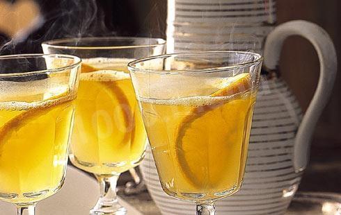 Mulled wine with orange, lemon, white wine and cinnamon