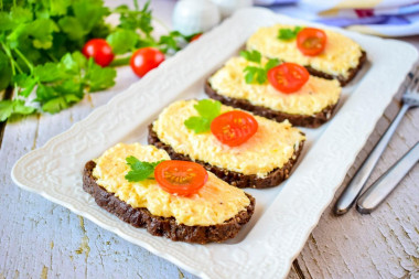 Sandwiches with black bread and cheese
