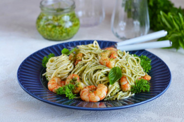 Pasta with pesto sauce and shrimp